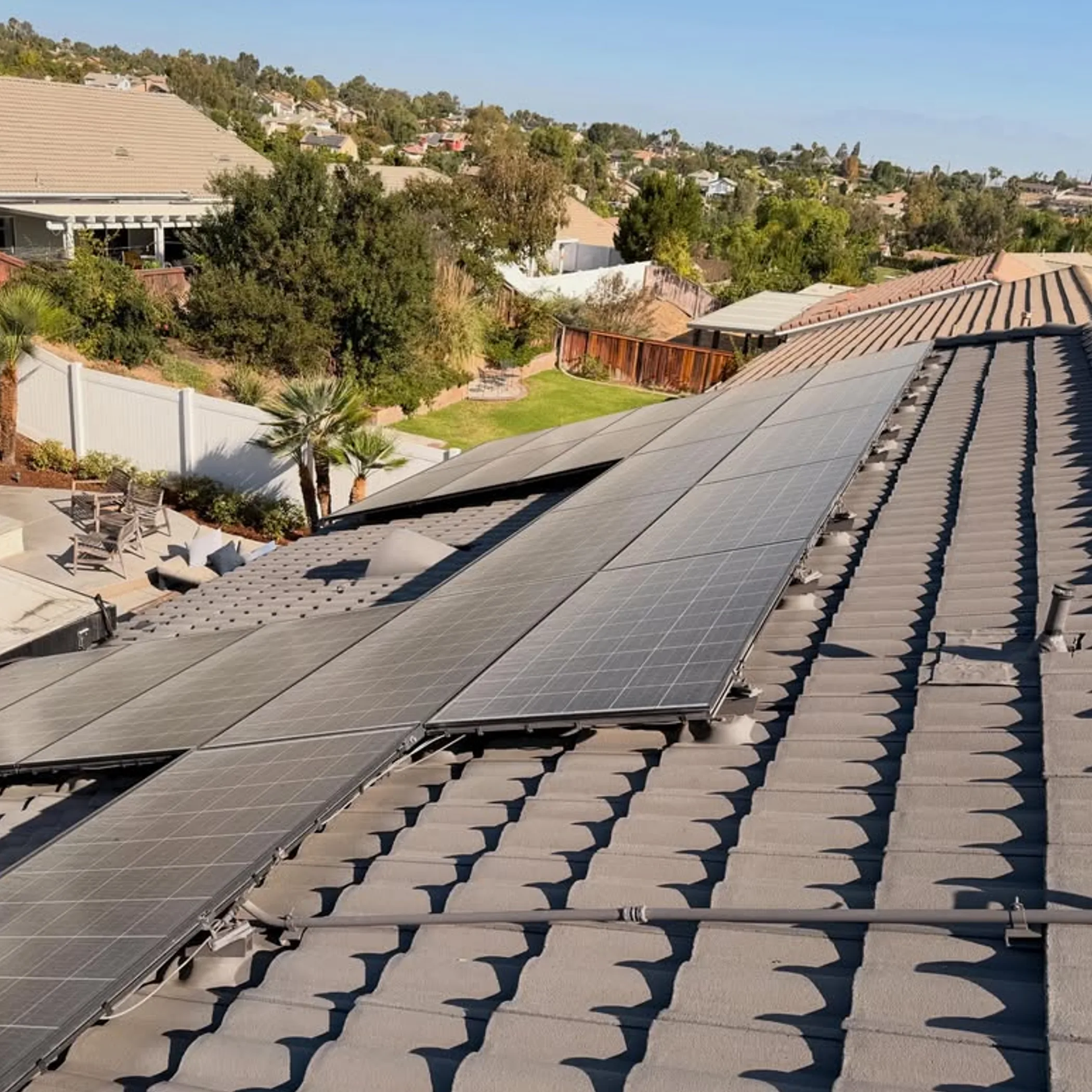 rooftop solar panels being cleaned